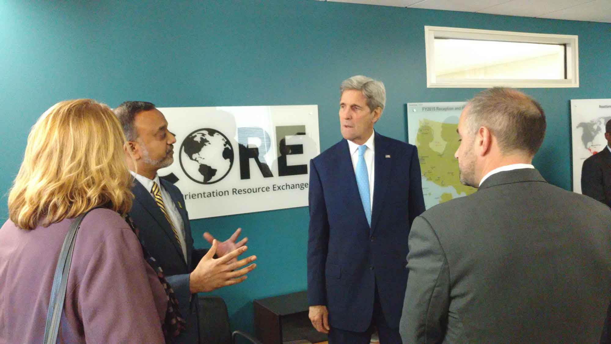 John Kerry speaking with CORE and IRC Silver Spring staff during a site visit
