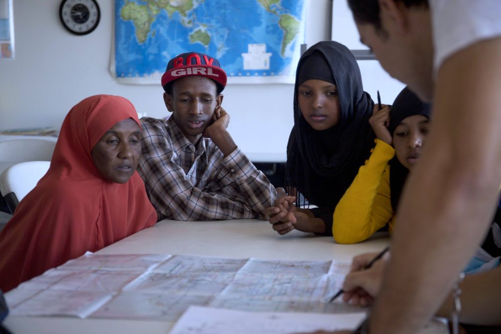 Refugees from Somalia are taught how to use the Phoenix public transportation system by IRC Phoenix staff.