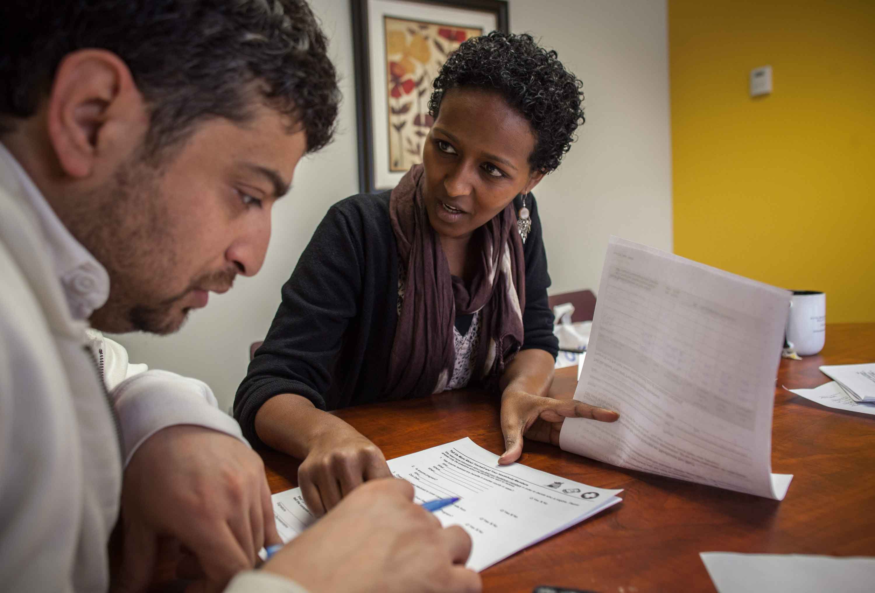 Refugee resettlement provider working with a newly resettled refugee