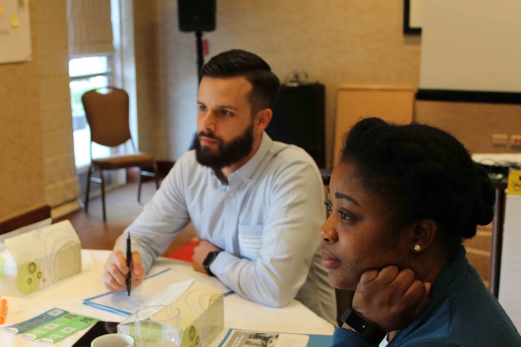 Cultural orientation staff working together during a CORE workshop