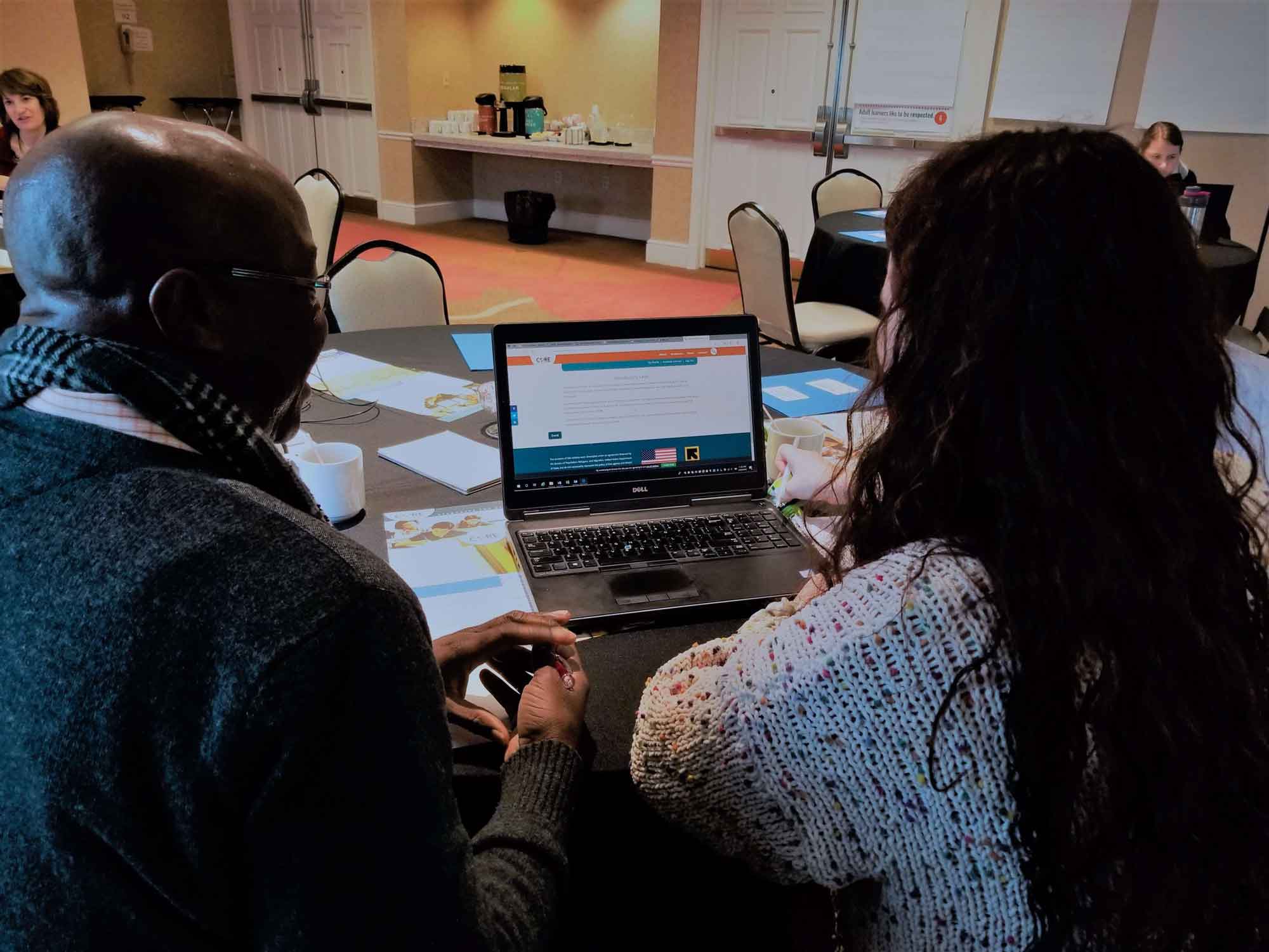 Cultural orientation providers looking through Cultural Orientation materials online