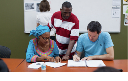 Refugees learning in a cultural orientation class