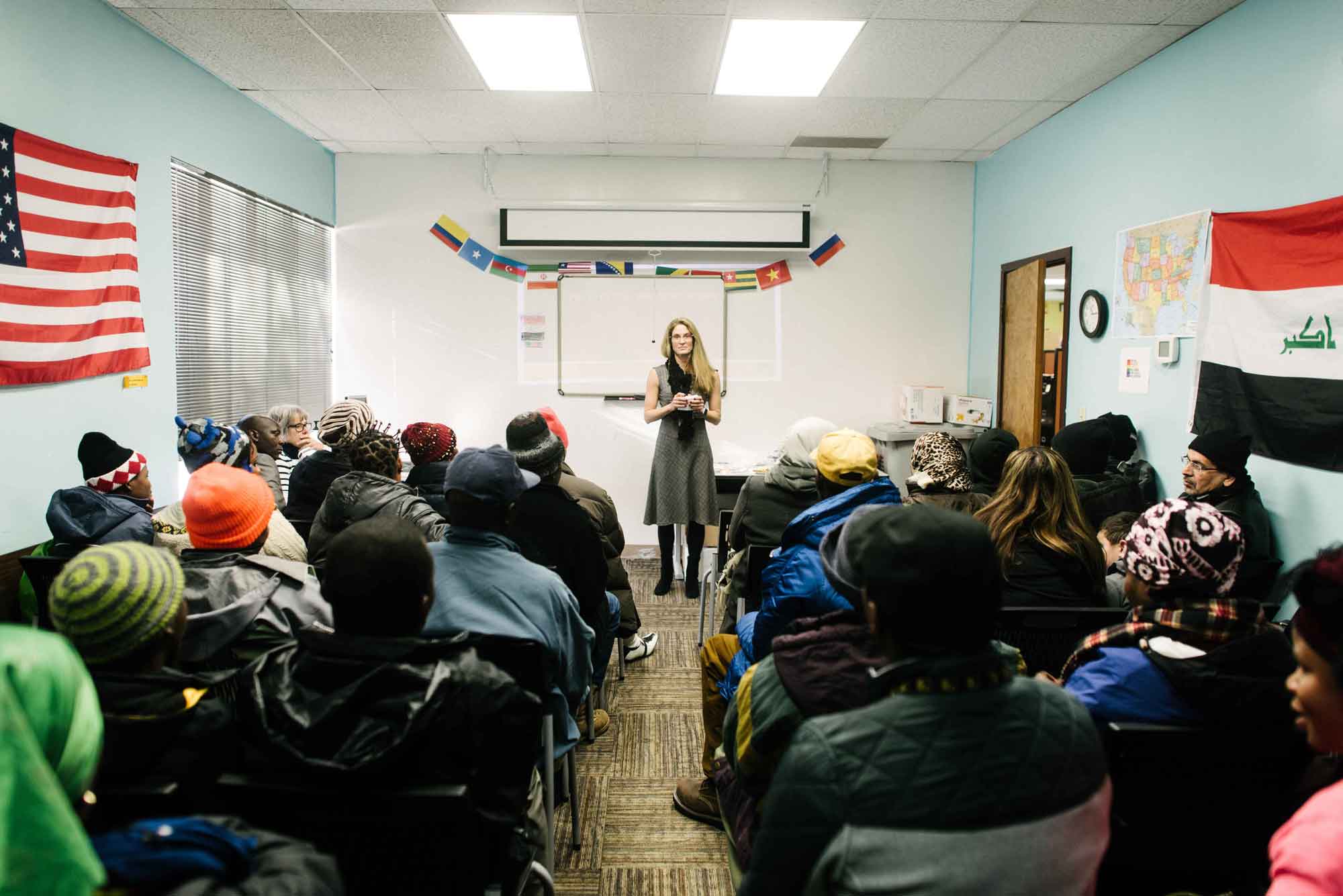 A cultural orientation provider leading a cultural orientation class in a resettlement office