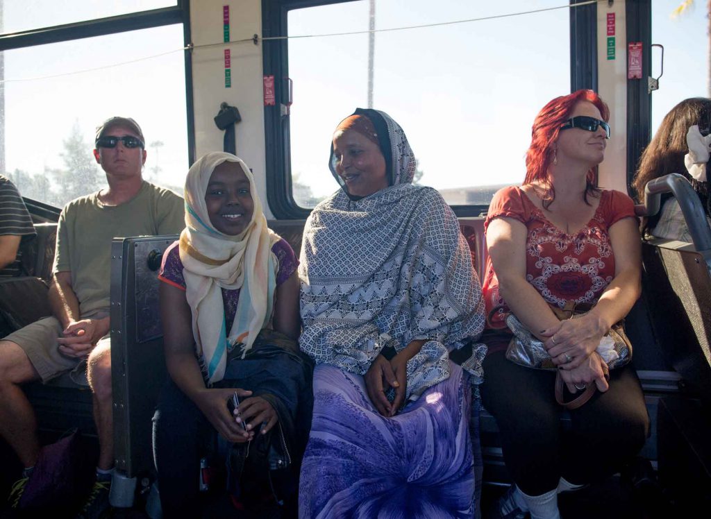 A pair of refugee women riding a bus. IRC/EFichtner